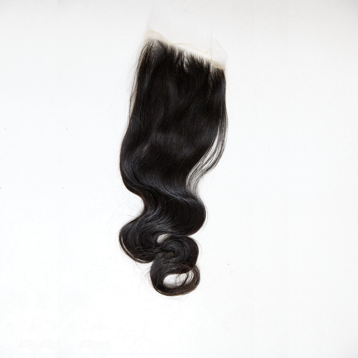 Black hair extension on a white background