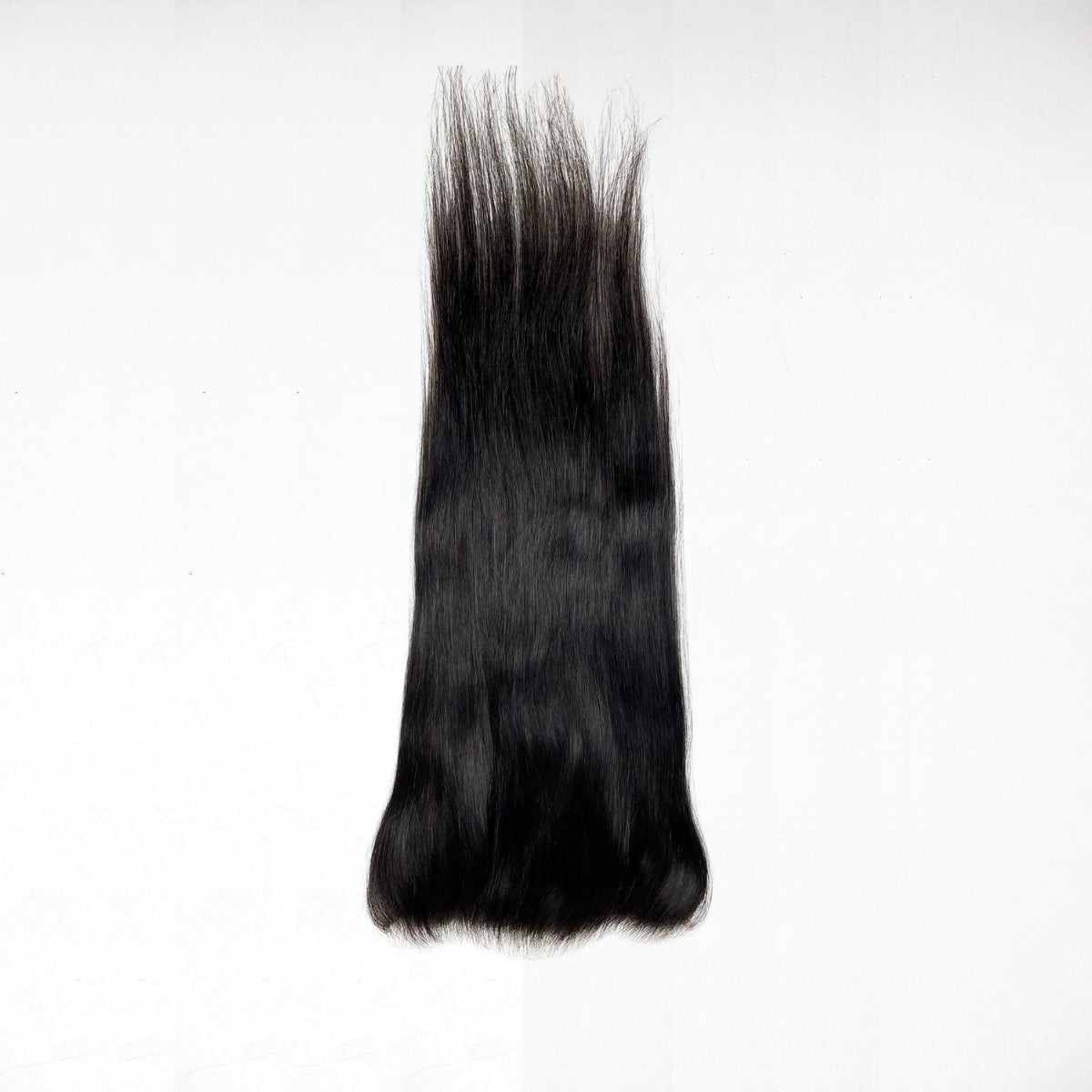 Black hair extension on a white background