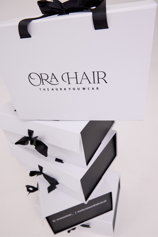 Ora Hair packaging with black ribbons on a white background