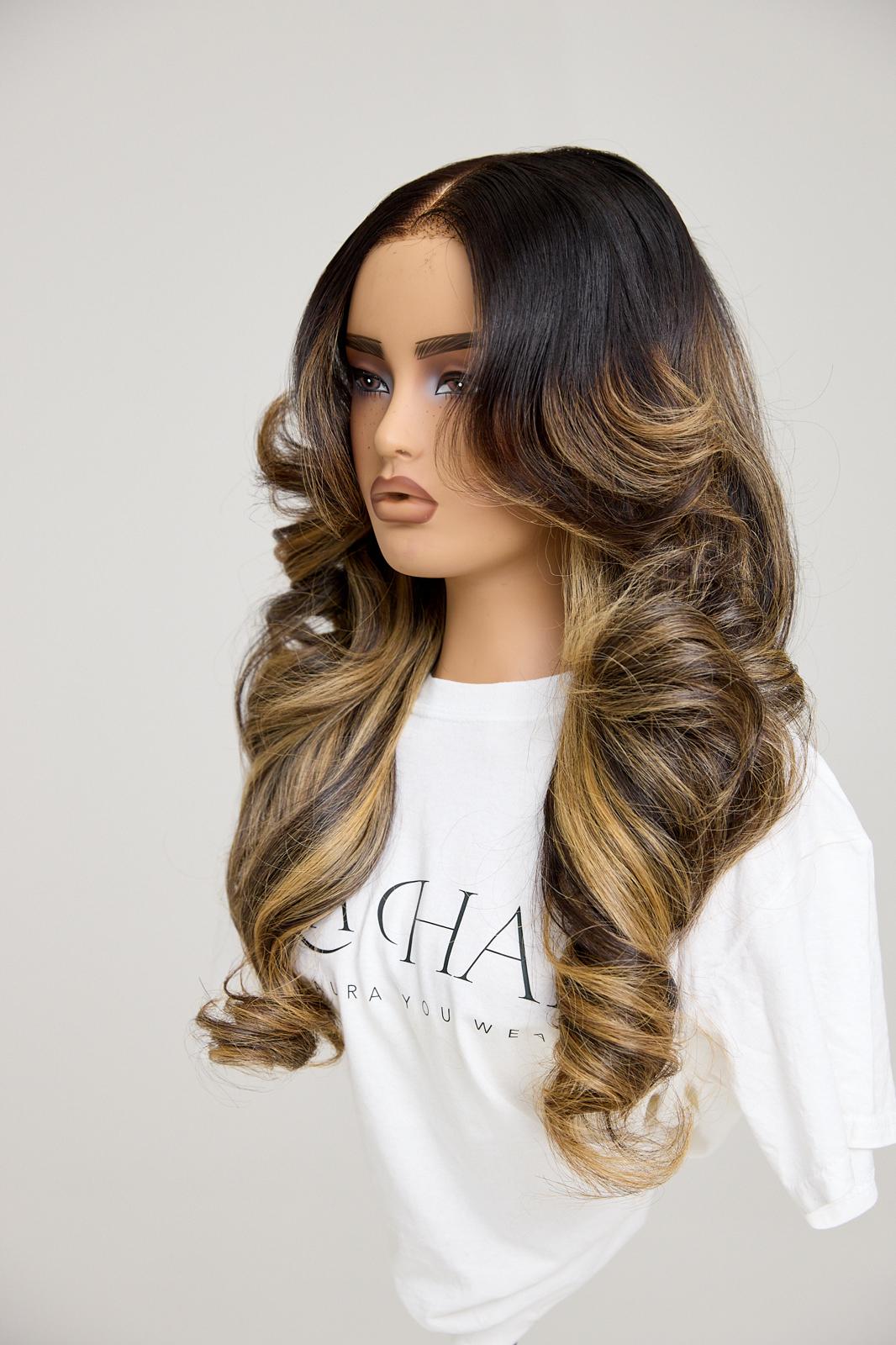 Mannequin head with long, wavy hair on a plain background