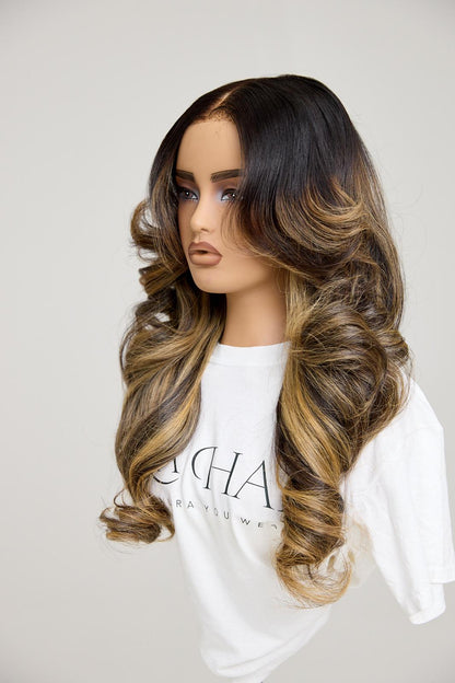 Mannequin head with long, wavy hair on a plain background